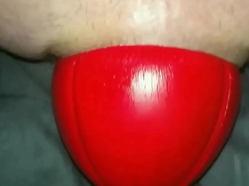 Huge 12 cm wide red football sliding out of my ass up close in slow motion